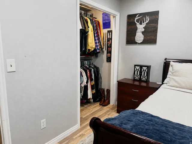 Built-in closet with shelving and hanging rods