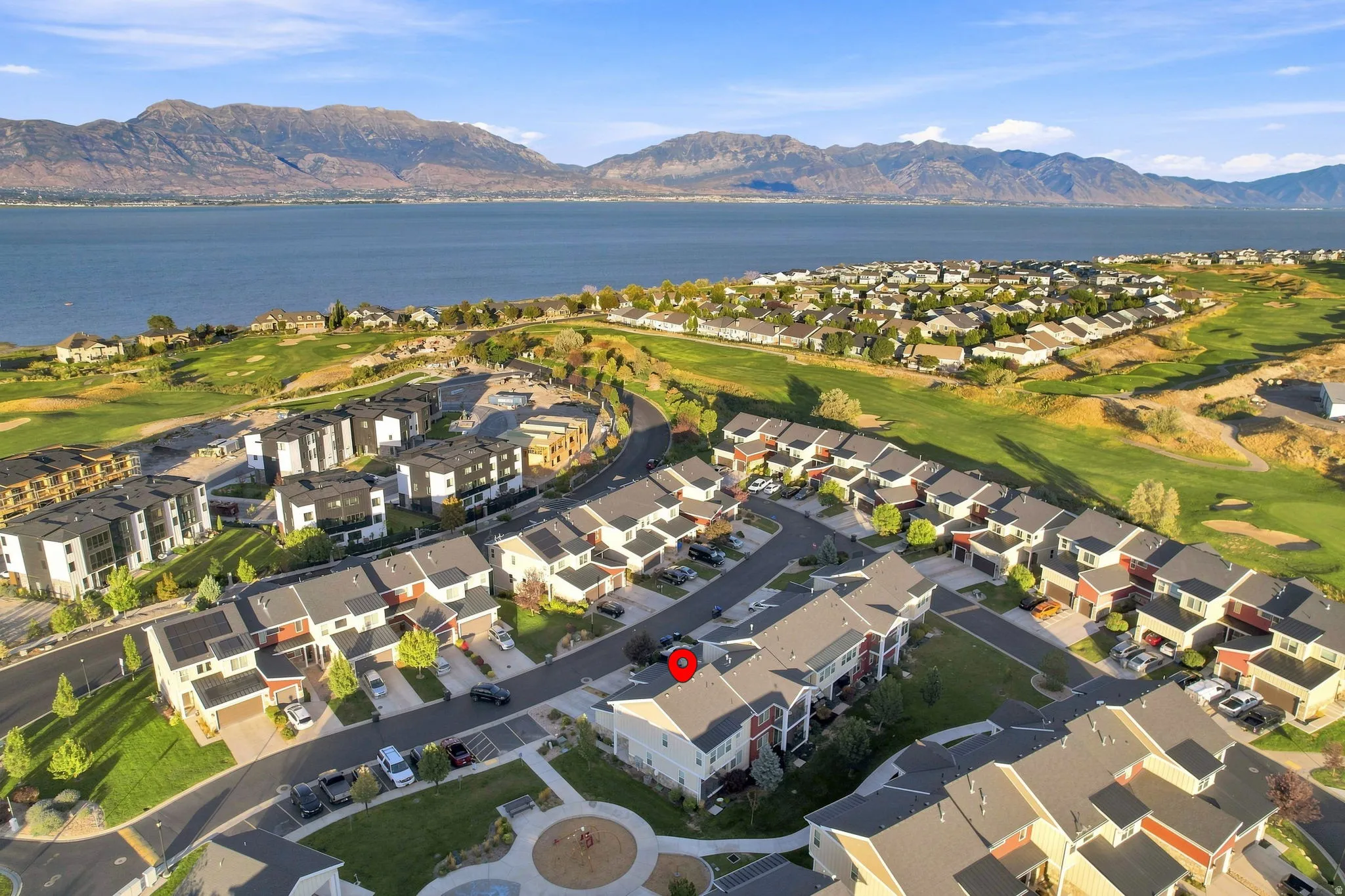 Residential community with a mountain and lake backdrop