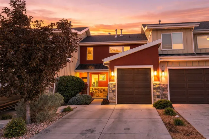 Multi-level exterior with stucco and siding finishes