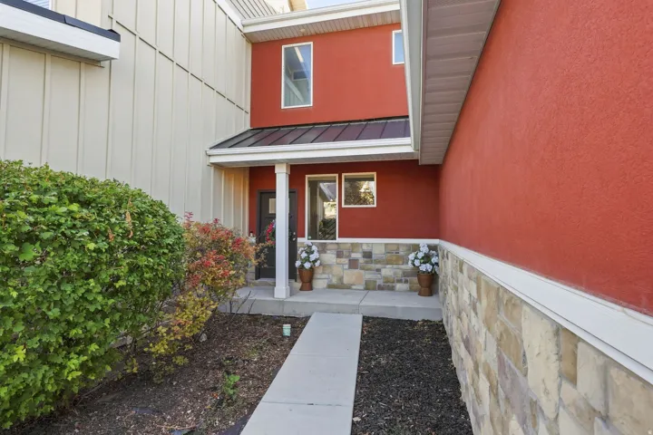 Red stucco exterior with complementary light-colored siding