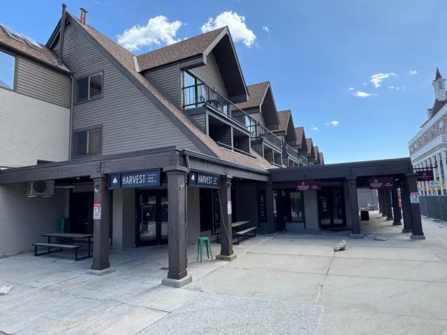 Multi-level building with gabled roof lines and exterior balconies