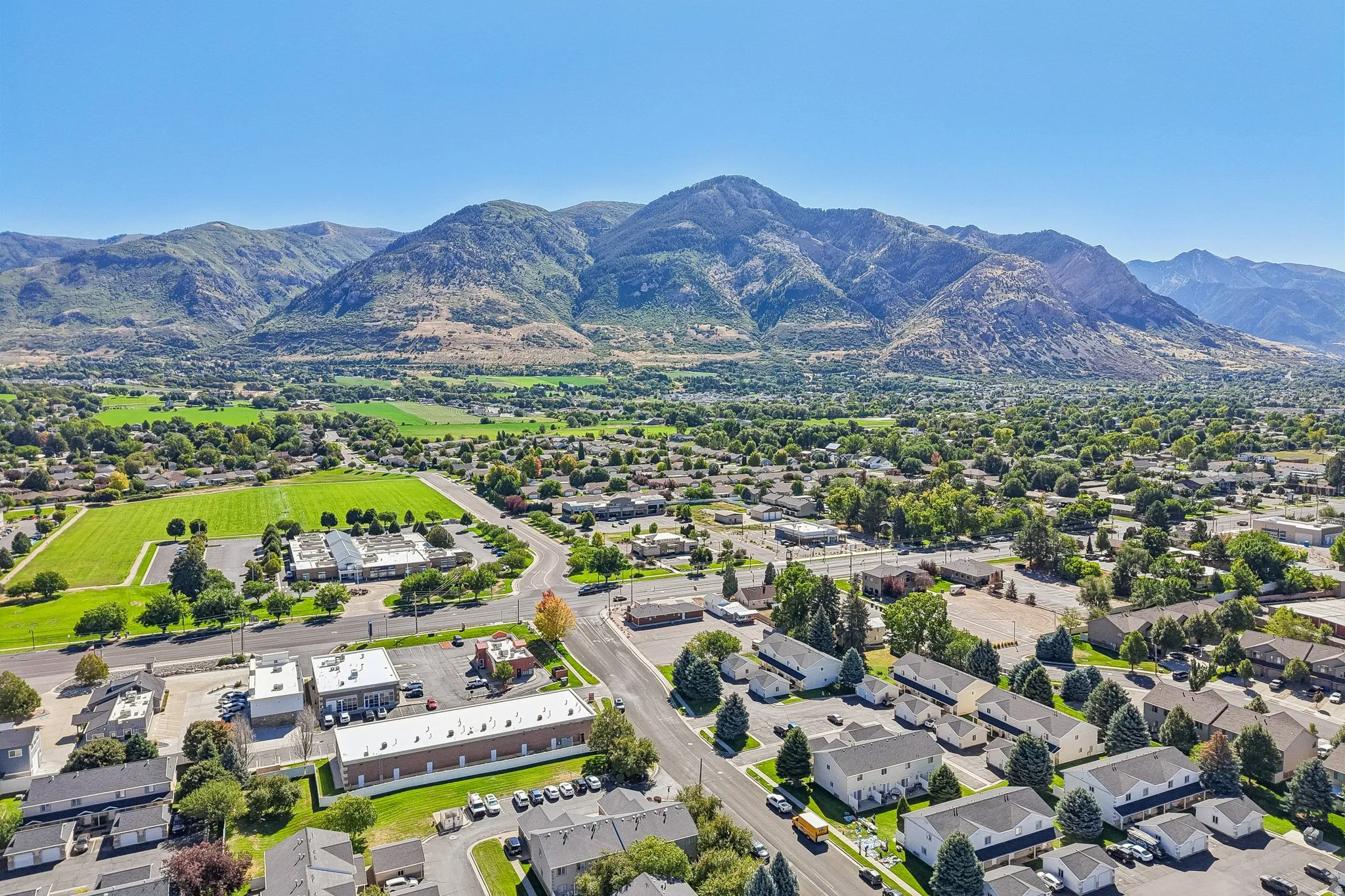 Expansive mountain range backdrop and verdant landscape