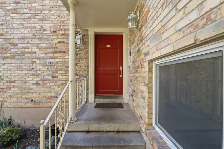 Brick exterior. Door that leads you into the building