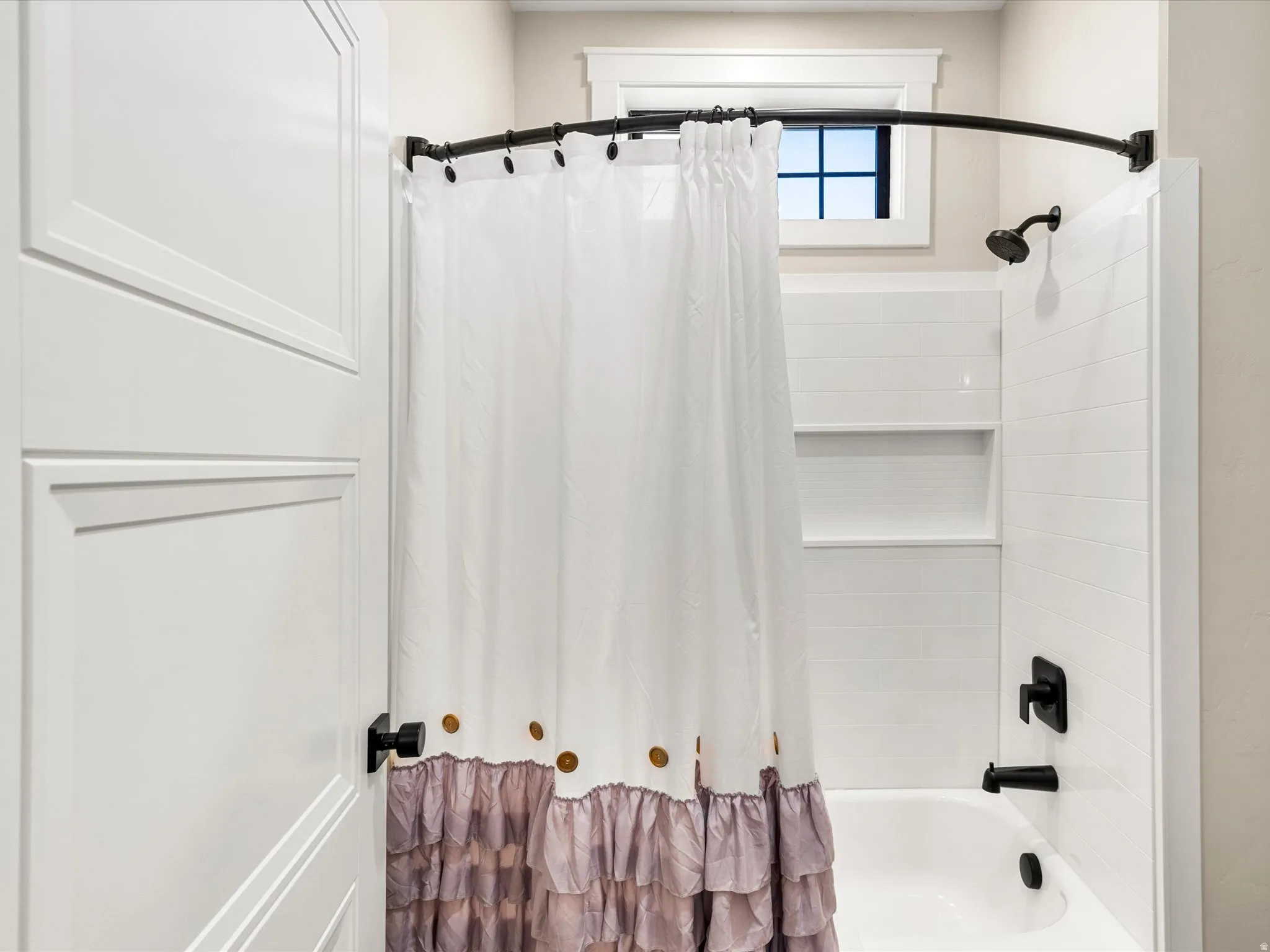 White paneled door with matte black hardware
