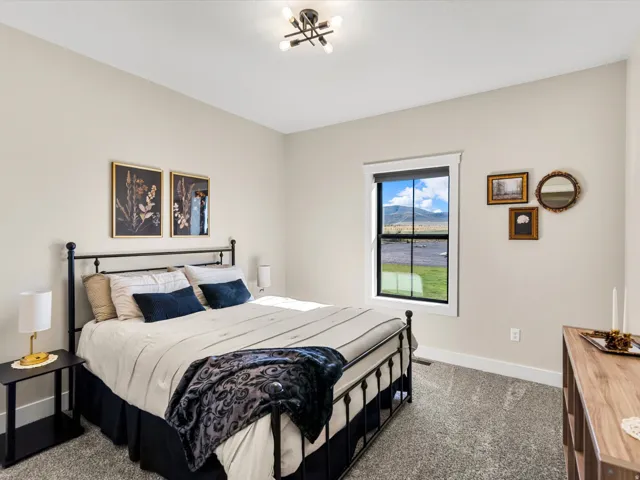 Neutral paint palette with recessed lighting and a single window with white trim