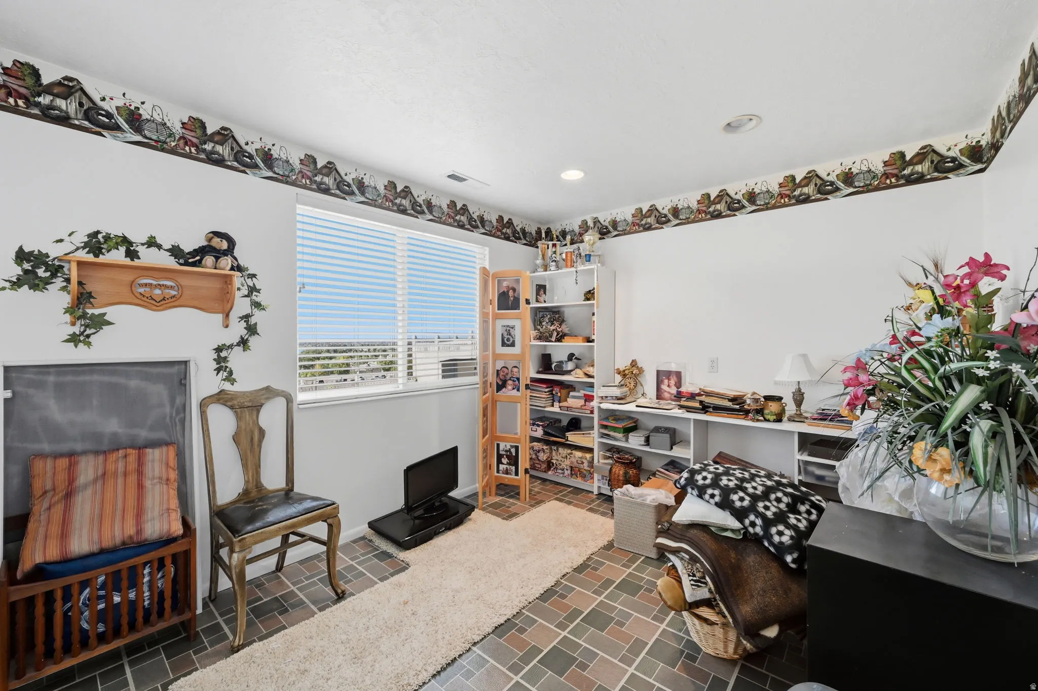 Second bedroom in basement, vinyl floors, window and closet