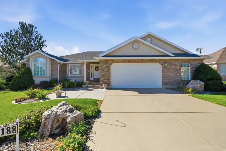 Brick and stucco exterior with an oversized two-car garage