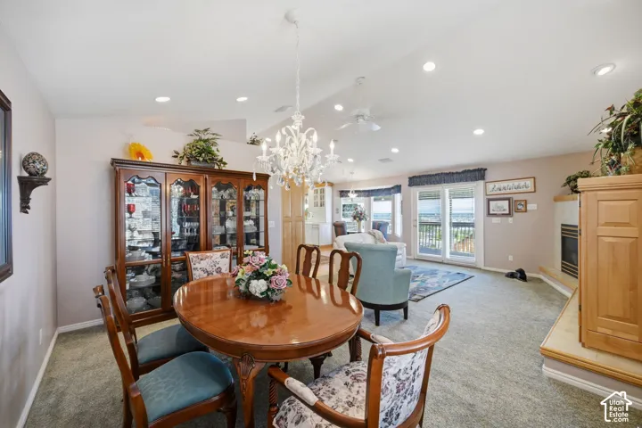 Open-concept living space with recessed lighting and expansive sliding  glass doors to the balcony