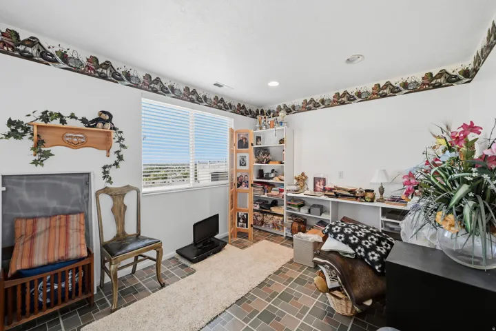 Second bedroom in basement, vinyl floors, window and closet