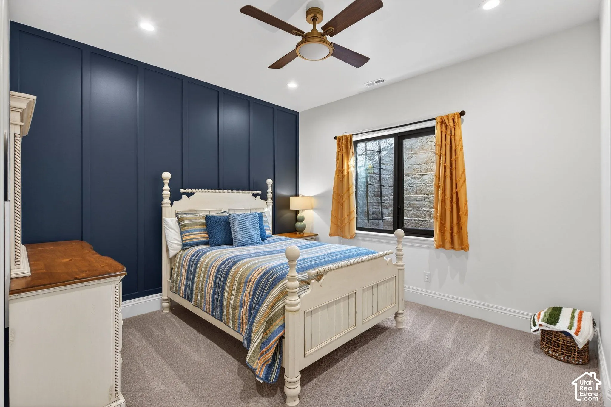 Accent wall with vertical paneling, ceiling fan
