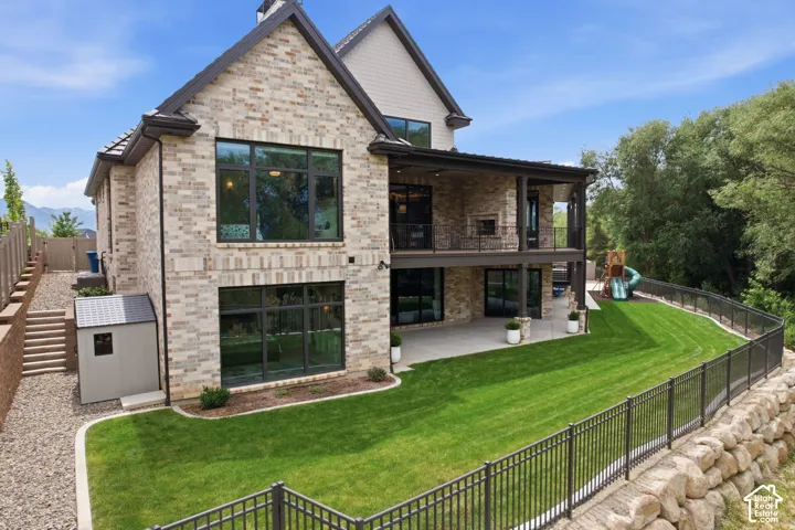 Brick and stone veneer exterior with dark-framed windows