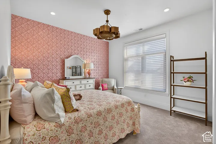 Accent wall, ceiling-mounted light fixture, automated window blinds