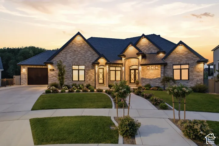 Brick and limestone entrances with bar tile roof