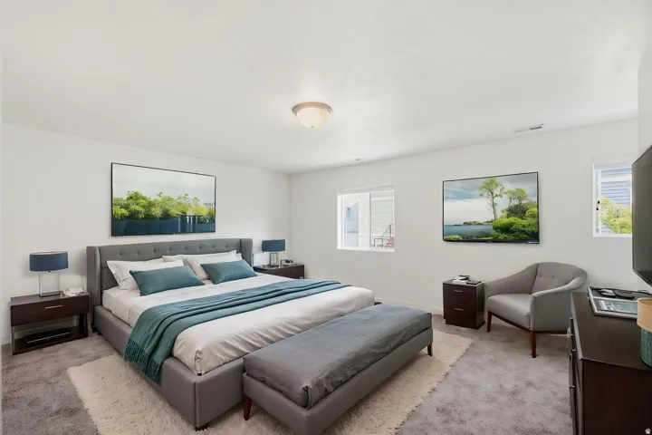 White walls complement the light-colored carpet, creating a bright atmosphere