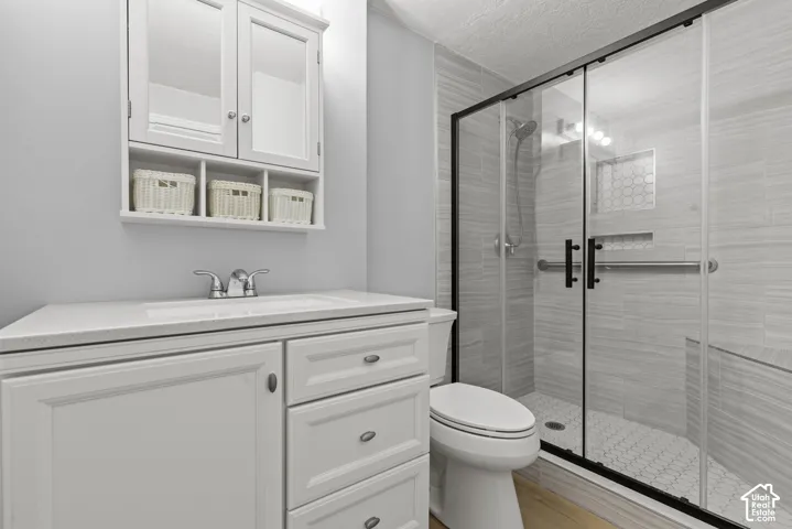 White vanity with integrated sink and chrome fixtures