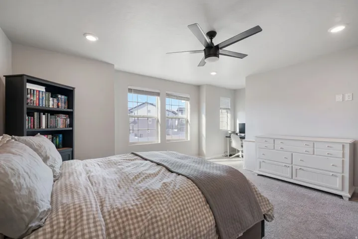 Recessed lighting, ceiling fan, and carpeted flooring