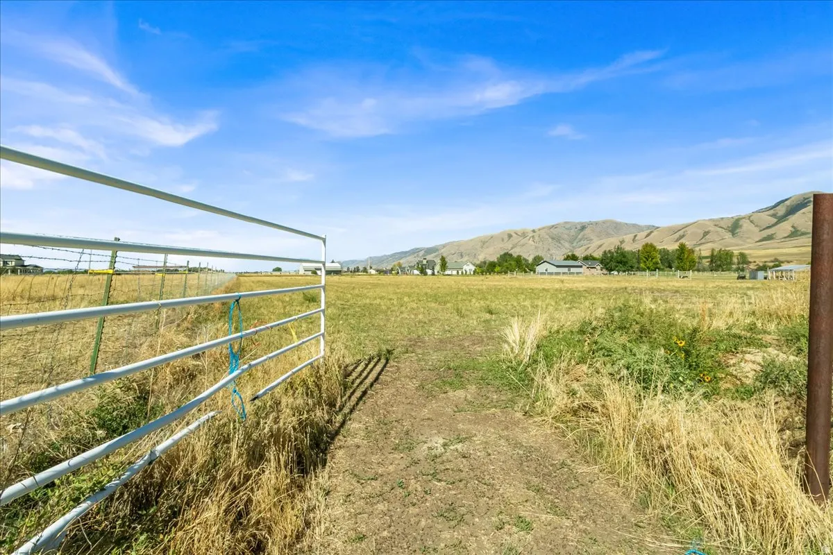 Expansive open field with a metal gate entrance