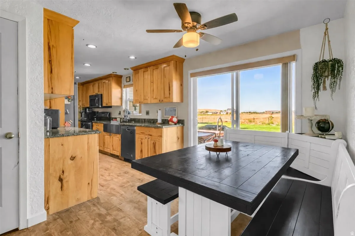 Kitchen featuring wood-finish cabinetry, recessed lighting, and a ceiling fan