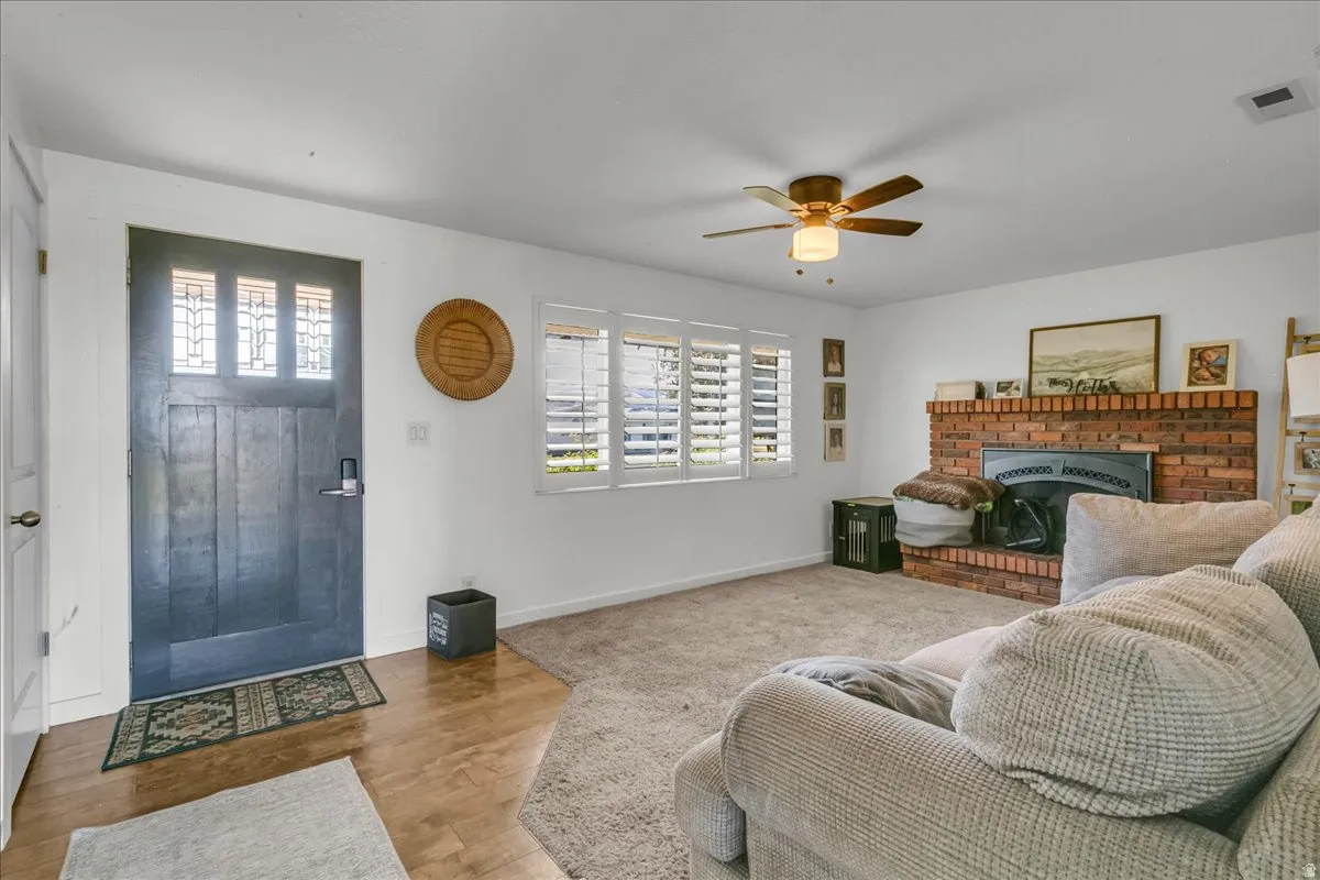 Entryway with a dark wood-finish door featuring leaded glass panels