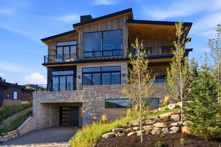 Modern architectural design with a natural wood exterior and stone accents