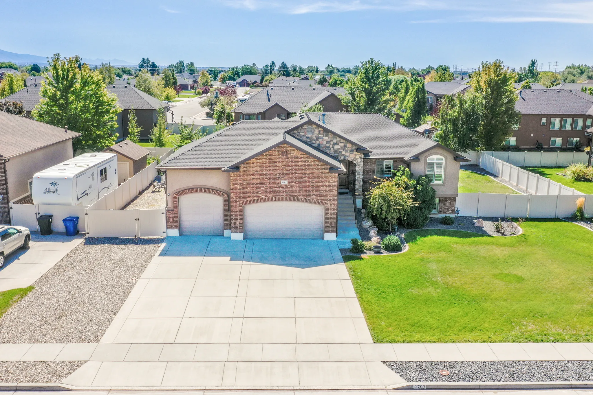 Brick and stone veneer exterior with a two-car garage