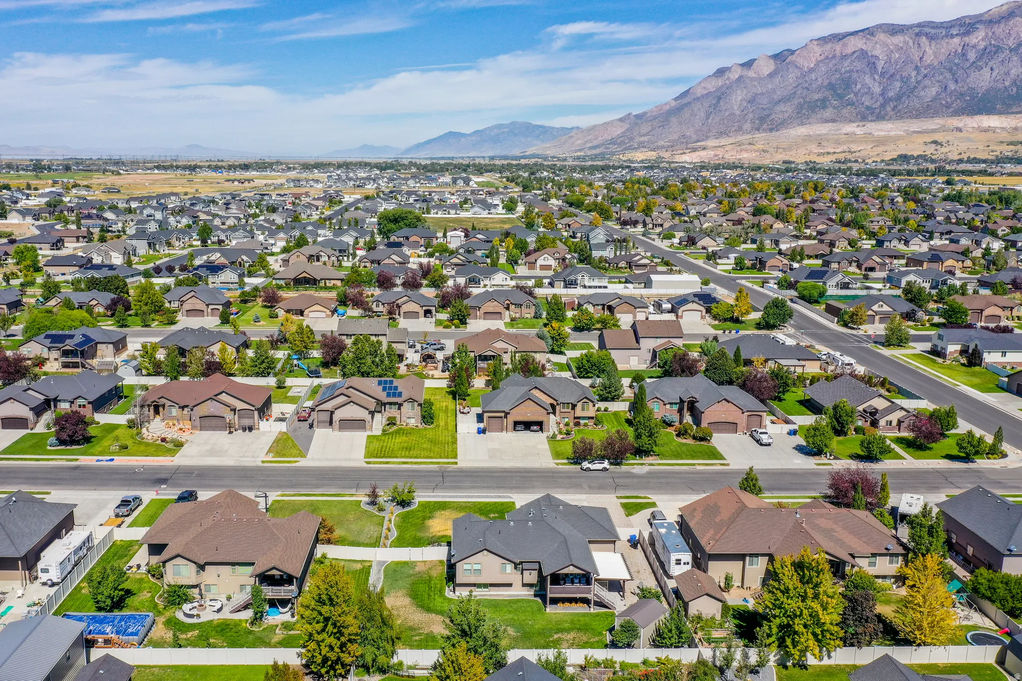 Residential neighborhood with mountain backdrop and mature landscaping
