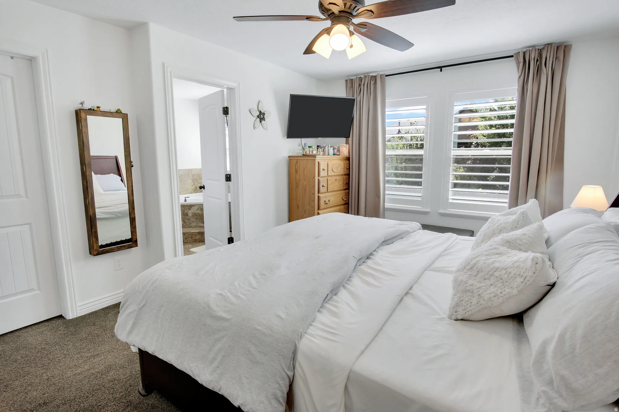 Recessed lighting, ceiling fan with integrated light, carpet flooring, and white interior doors