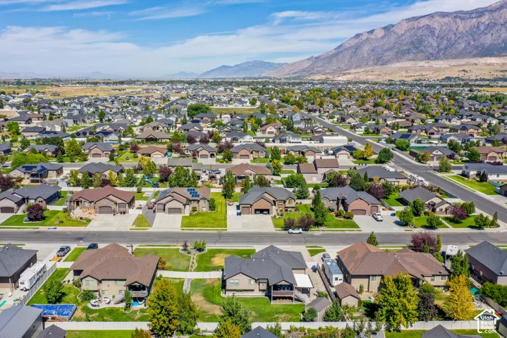 Residential neighborhood with mountain backdrop and mature landscaping