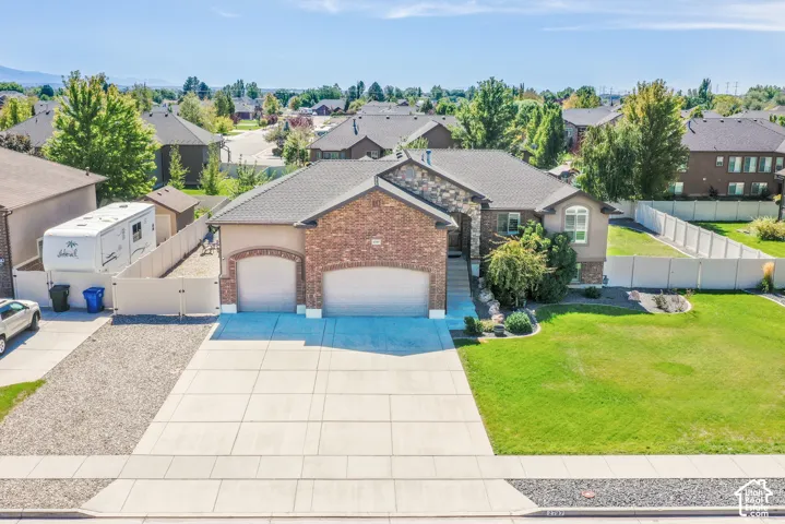 Brick and stone veneer exterior with a two-car garage