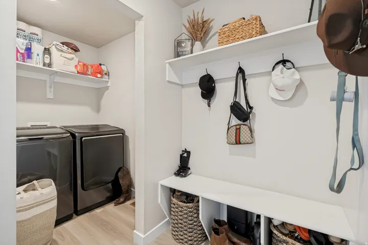 Built-in shelving, integrated storage bench, and wall-mounted hooks