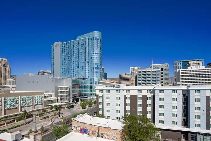 Cityscape featuring multiple high-rise buildings and contemporary architecture