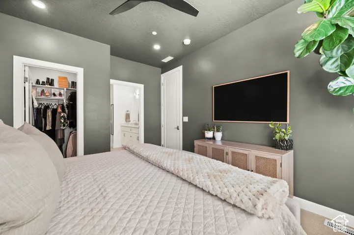Primary bedroom with ensuite bathroom, walk-in closet