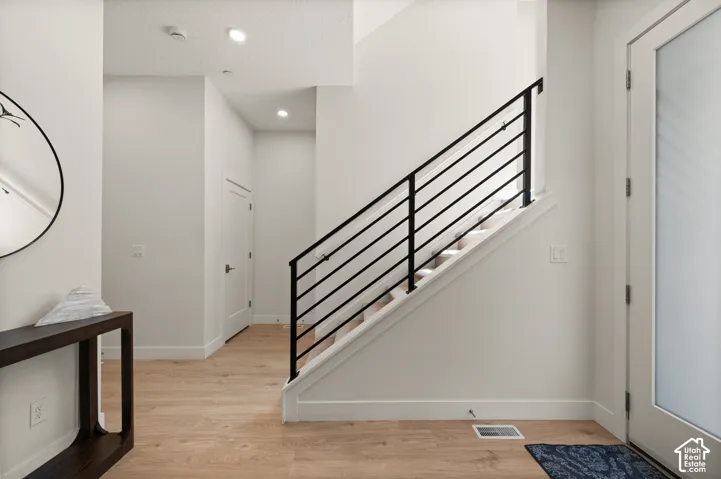 Hardwood-finish flooring throughout the light-filled entryway