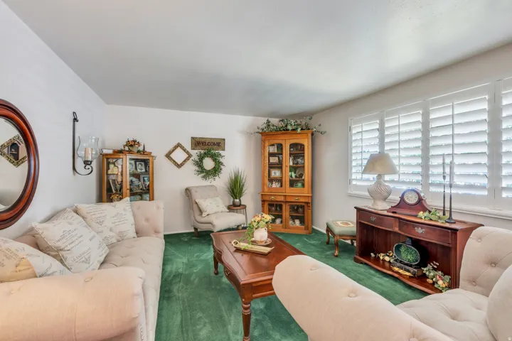 White walls with green carpeting
