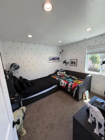 Recessed ceiling lighting, window with blinds, and wall-to-wall carpeting