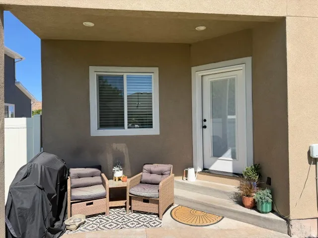 Covered patio with recessed lighting and stucco exterior