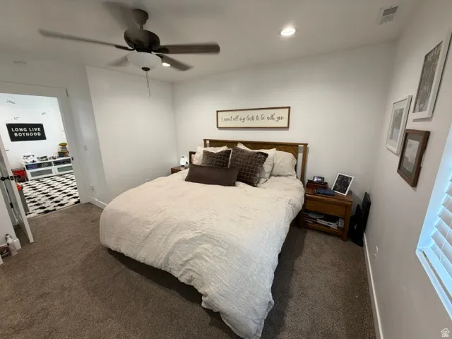 Recessed ceiling lighting, ceiling fan, and carpeted flooring