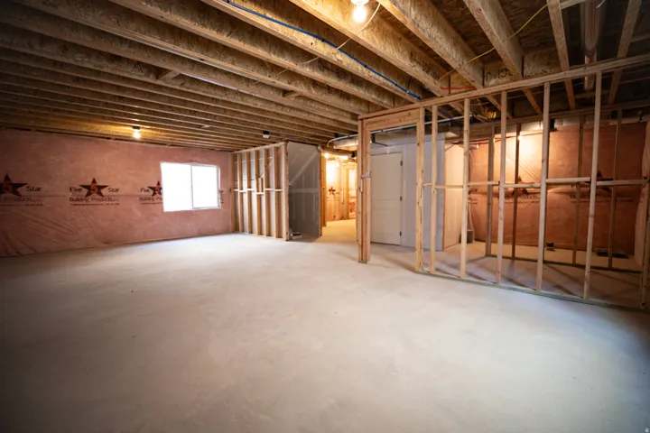 Unfinished basement with potential for large family/game room, full bathroom, one bedroom and large storage closet.