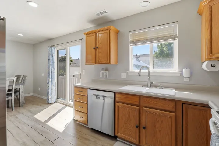 Light wood-finish flooring with recessed lighting
