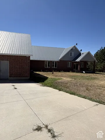 Brick exterior with a corrugated metal roof