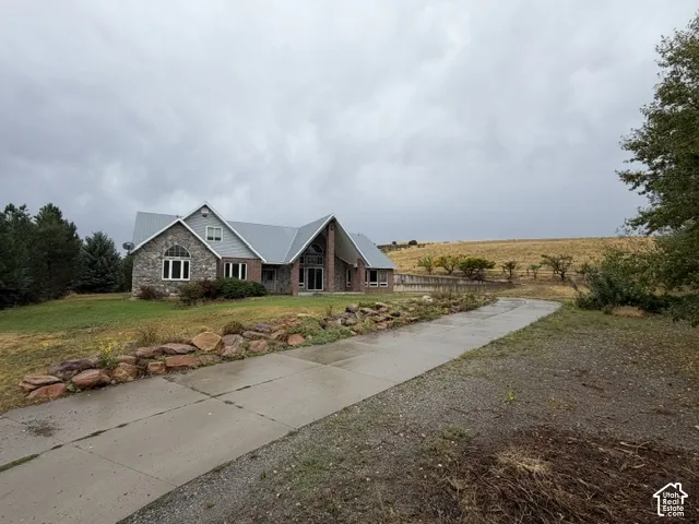 Stone and brick exterior with a metal roof