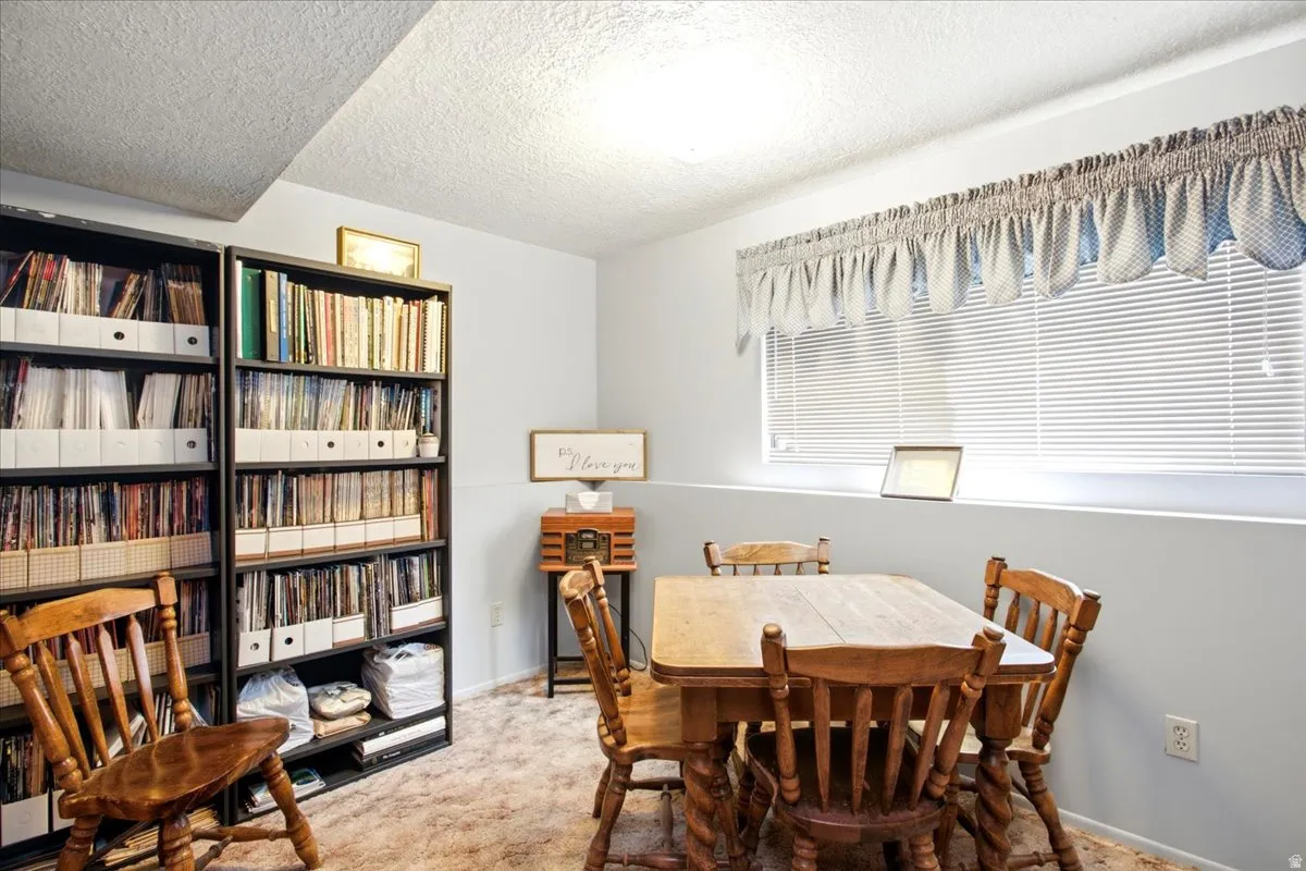 Wall-to-wall carpeting and white walls