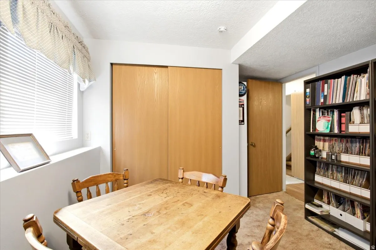 Sliding wood-finish closet doors, recessed window, and built-in shelving