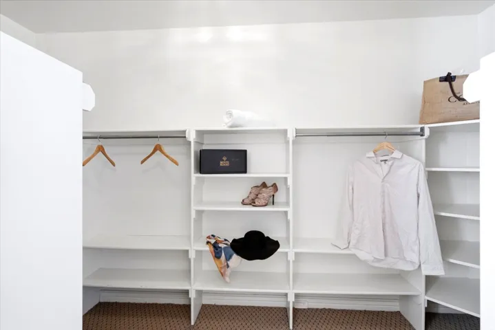 Integrated shelving system with multiple storage levels and hanging rods