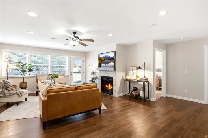 Wood-finish flooring throughout, recessed lighting, and a ceiling fan