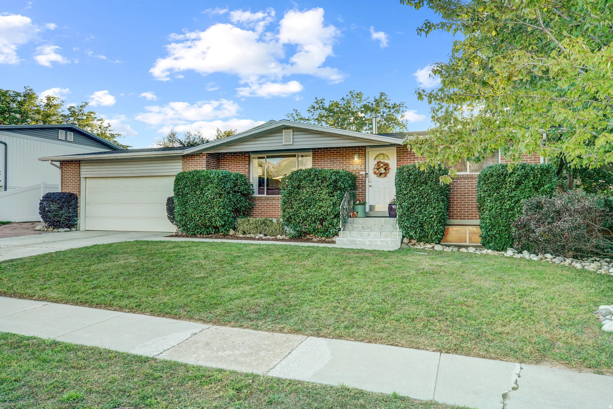 Brick exterior with a covered front entry and a single-car garage