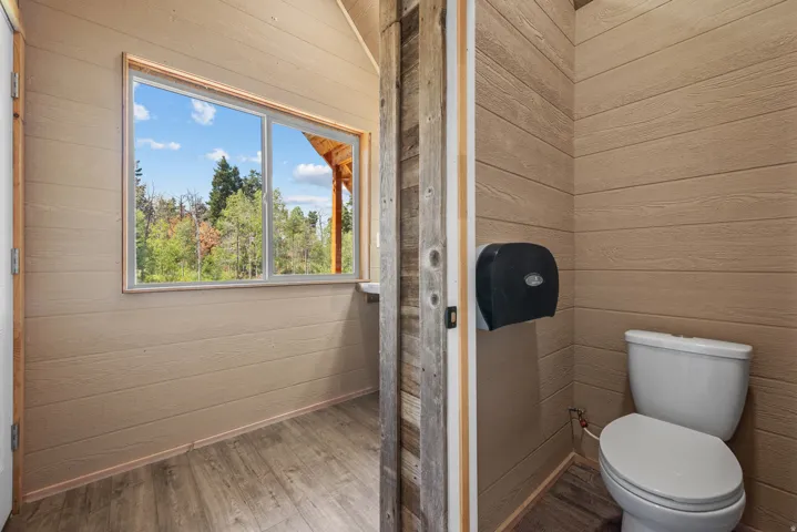 Wood-finish plank walls complemented by wood-finish flooring