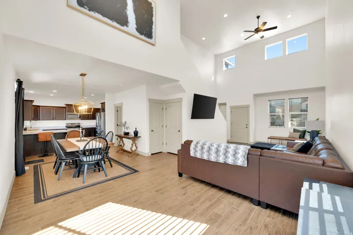 Vaulted ceilings, recessed lighting, and large windows provide an open atmosphere