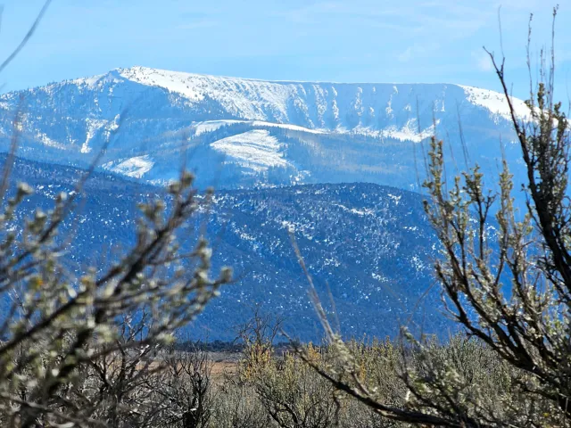 Snow-capped mountain range with a clear blue sky