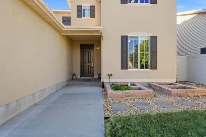 Stucco exterior with decorative shutters